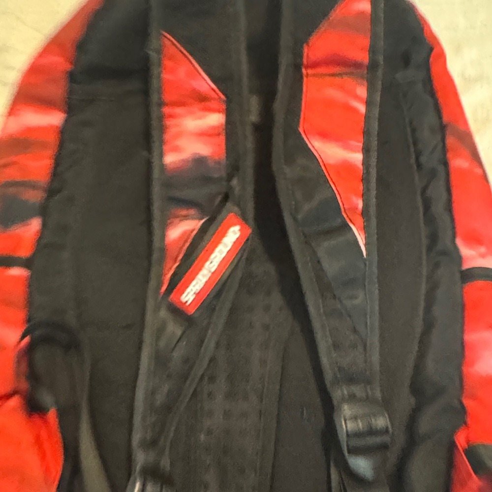 Sprayground Red and Black Tie-Dye Backpack with White Symbol - Picture 6 of 12